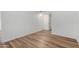 A bright bedroom features wood-look floors and white walls at 520 N Stapley Dr # 123, Mesa, AZ 85203