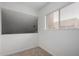 Upstairs room with large window and neutral carpet at 520 N Stapley Dr # 123, Mesa, AZ 85203