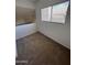 Second story bedroom with neutral carpet and large window at 520 N Stapley Dr # 123, Mesa, AZ 85203