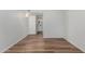 A bright bedroom features wood-look floors with an attached bathroom at 520 N Stapley Dr # 123, Mesa, AZ 85203