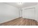 Bedroom with wood-look floors and a large closet in view at 520 N Stapley Dr # 123, Mesa, AZ 85203