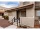 Inviting front exterior with private entrance, desert landscaping, and tile roof at 520 N Stapley Dr # 123, Mesa, AZ 85203