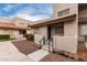Exterior view of townhome featuring desert landscaping, private entrance, and red tile roof at 520 N Stapley Dr # 123, Mesa, AZ 85203