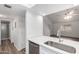 Kitchen area features light counters, stainless appliances, modern hardware, and wood floors at 520 N Stapley Dr # 123, Mesa, AZ 85203