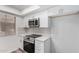 Modern kitchen with stainless steel appliances, light countertops, and bright lighting at 520 N Stapley Dr # 123, Mesa, AZ 85203