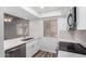 Charming kitchen area featuring stainless steel appliances, modern fixtures and bright lighting at 520 N Stapley Dr # 123, Mesa, AZ 85203