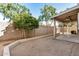 The backyard features an open layout and established trees for outdoor enjoyment at 6857 S Roosevelt St, Tempe, AZ 85283