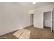 Bedroom features a standard closet and neutral carpeting at 6857 S Roosevelt St, Tempe, AZ 85283