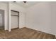 Bedroom with carpeted floor, fan and closet at 6857 S Roosevelt St, Tempe, AZ 85283