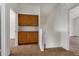Hallway with wooden cabinets at 6857 S Roosevelt St, Tempe, AZ 85283