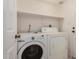 Laundry room with a washing machine and dryer at 6857 S Roosevelt St, Tempe, AZ 85283
