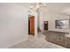 Open living space showcasing neutral carpet, tile flooring, and natural light, creating an airy feel at 6857 S Roosevelt St, Tempe, AZ 85283