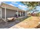 Large backyard with covered patio, mature tree, and ample space for outdoor activities at 7952 W Oregon Ave, Glendale, AZ 85303