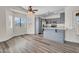 Bright kitchen with grey cabinets, stainless steel appliances, and breakfast nook with large windows at 7952 W Oregon Ave, Glendale, AZ 85303
