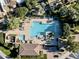 Stunning aerial view of a community pool with ample lounge seating and lush landscaping at 7955 E Chaparral Rd # 116, Scottsdale, AZ 85250