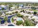 Expansive aerial view of the community showcasing the pool, surrounding landscaping, and neighborhood at 7955 E Chaparral Rd # 116, Scottsdale, AZ 85250