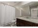 This bathroom features a granite countertop and a tub shower at 8046 W Agora Ln, Phoenix, AZ 85043
