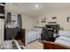 This bedroom features neutral paint, carpeting and ample space for sleep and study at 8046 W Agora Ln, Phoenix, AZ 85043