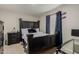 This primary bedroom is a relaxing retreat with plush carpet, and an elegant furniture suite at 8046 W Agora Ln, Phoenix, AZ 85043