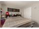 This bedroom features decorative wall art, neutral paint and plush carpeting for ultimate comfort and quiet enjoyment at 8046 W Agora Ln, Phoenix, AZ 85043