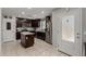 Well-equipped kitchen with stainless steel appliances, granite counters, and dark cabinetry at 8046 W Agora Ln, Phoenix, AZ 85043