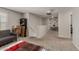 Open loft area with carpeting that has neutral walls and a cozy seating area at 8046 W Agora Ln, Phoenix, AZ 85043