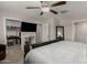 View of main bedroom with a walk-in closet, neutral color, with a ceiling fan at 8046 W Agora Ln, Phoenix, AZ 85043