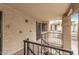 Apartment balcony view featuring stairs and entry doors with security gates at 925 S Longmore -- # 210, Mesa, AZ 85202