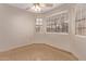 Bright bedroom featuring tile floors, neutral paint, and natural light from windows at 925 S Longmore -- # 210, Mesa, AZ 85202