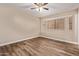 Bedroom with neutral walls, wood floors, and a bright window seat at 925 S Longmore -- # 210, Mesa, AZ 85202