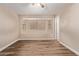 Spacious bedroom with wood floors, neutral walls, and a well-lit window seat at 925 S Longmore -- # 210, Mesa, AZ 85202