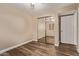 This bedroom features wood flooring, a ceiling fan, and a large mirrored closet at 925 S Longmore -- # 210, Mesa, AZ 85202