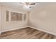 Bedroom with neutral walls, wood floors, and a bright window seat at 925 S Longmore -- # 210, Mesa, AZ 85202