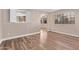Modern living room with wood-look floors, neutral walls, and archway to another room at 925 S Longmore -- # 210, Mesa, AZ 85202