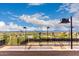 Well-maintained tennis courts with mountain views and desert landscaping in a vibrant community at 13621 E Aster Dr, Scottsdale, AZ 85259