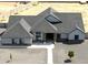 Expansive single-story home boasts gravel landscaping and gray shingles at 34949 N Donald Way, San Tan Valley, AZ 85140