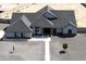 Expansive single-story home featuring a modern design, complemented by a durable roof and low-maintenance gravel landscaping at 34949 N Donald Way, San Tan Valley, AZ 85140