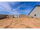 Spacious backyard with block fencing, offering privacy and ample room for customization at 34949 N Donald Way, San Tan Valley, AZ 85140