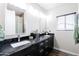 Bathroom with a marble double vanity and modern fixtures at 34949 N Donald Way, San Tan Valley, AZ 85140