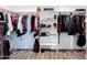 Walk-in closet with wood-look floors and white shelving, providing ample storage space at 34949 N Donald Way, San Tan Valley, AZ 85140