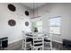 Bright dining area with a modern light fixture and views of the backyard at 34949 N Donald Way, San Tan Valley, AZ 85140