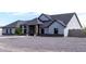 Stunning single-story home with elegant stone pillars, a charming walkway, and a minimalist gravel front yard at 34949 N Donald Way, San Tan Valley, AZ 85140