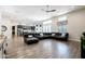 Bright living area with wood floors, a ceiling fan and an open concept at 34949 N Donald Way, San Tan Valley, AZ 85140