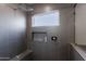 Modern shower features tiled walls, rainfall showerhead, and a built-in tiled bench at 34949 N Donald Way, San Tan Valley, AZ 85140