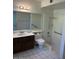Bathroom features an accessible walk-in shower, handrails, and a large mirror over sink at 4741 W Annette Cir, Glendale, AZ 85308