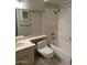 Bathroom featuring a combination tub and shower unit with white tiles at 4741 W Annette Cir, Glendale, AZ 85308