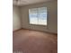 Bedroom with a ceiling fan and a large window allowing natural light to illuminate the space at 4741 W Annette Cir, Glendale, AZ 85308