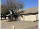 Single-story home with a two-car garage and low-maintenance front yard landscape at 4741 W Annette Cir, Glendale, AZ 85308