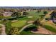 Aerial view of the golf course, with sand traps, walking trails and a meticulously manicured green at 4741 W Annette Cir, Glendale, AZ 85308