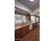 Well lit kitchen features wood flooring, wooden cabinets, and a window over the sink at 4741 W Annette Cir, Glendale, AZ 85308